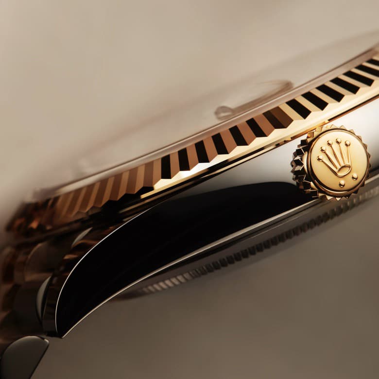 Rolex Datejust, highlighting fluted bezel and the crown